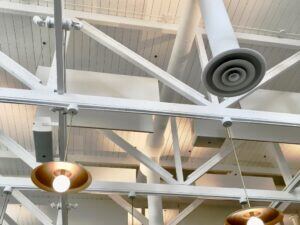 Ceiling of commercial building with Exposed lighting and HVAC air ducts